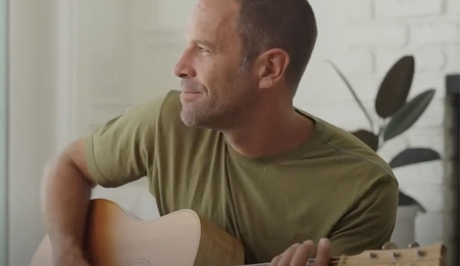 Jack Johnson playing guitar