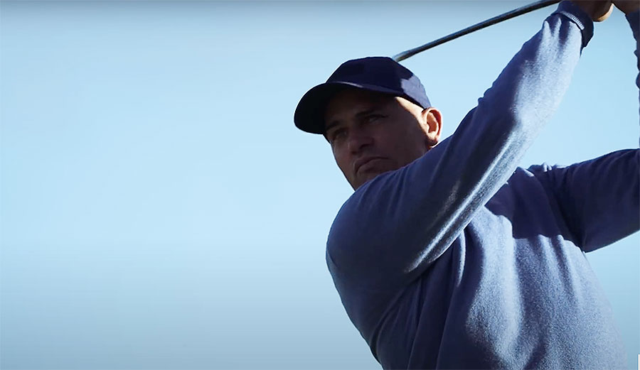 Kelly Slater playing golf