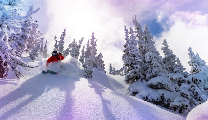 Skier in powder for Ikon Pass