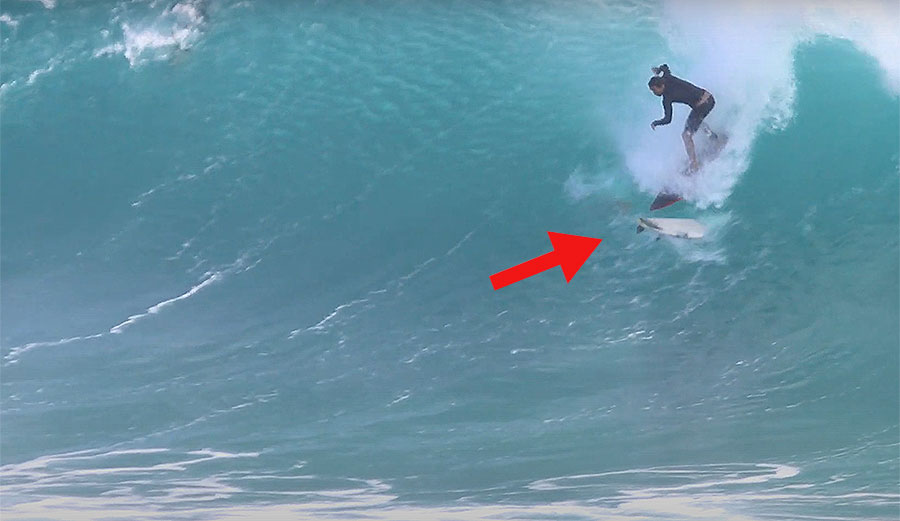 surfer poo-shoots surfboard at Kirra