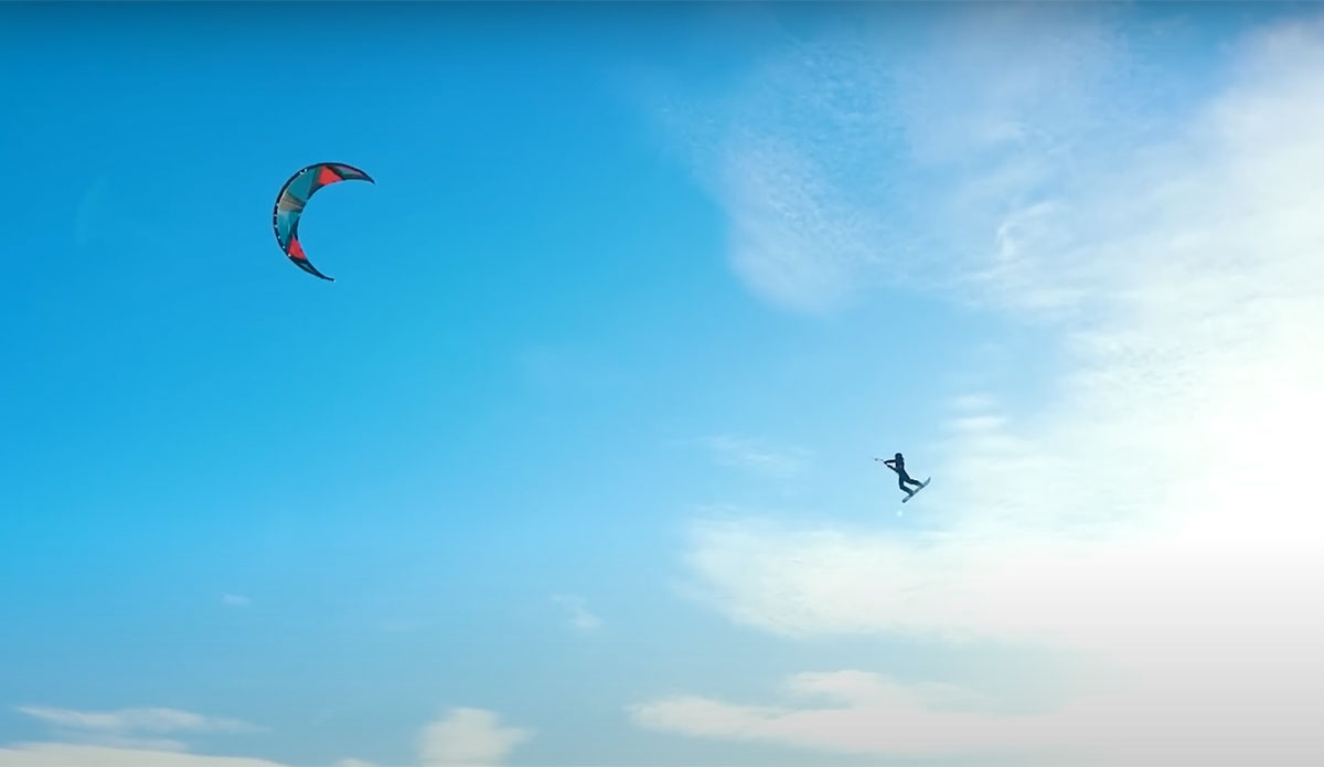 Parasailing behind snowmobile