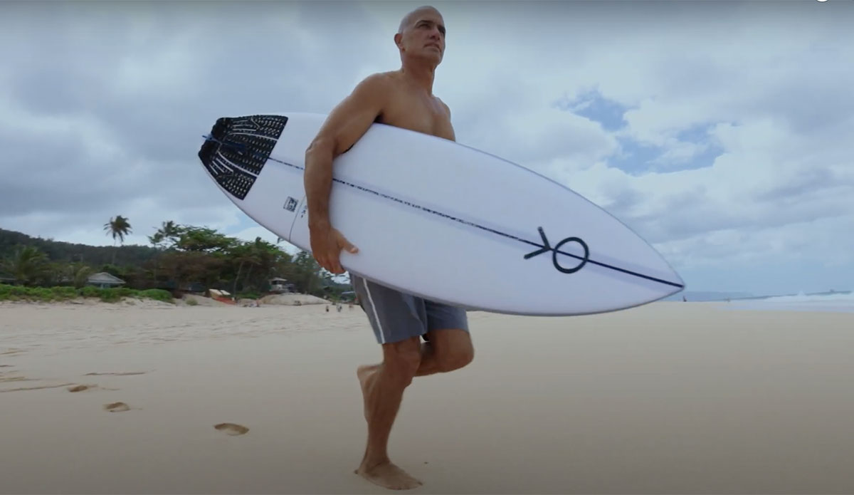Kelly Slater with surfboard