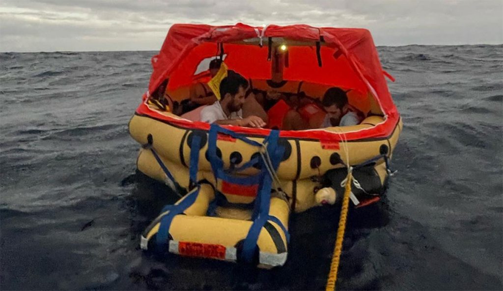 sailors in life raft after whale strike