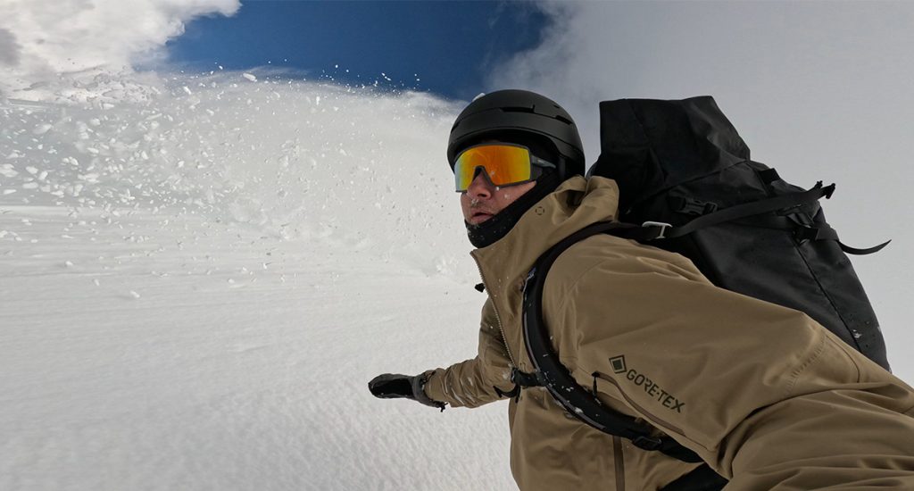 snowboarding in powder with smith pursuit backcountry glasses