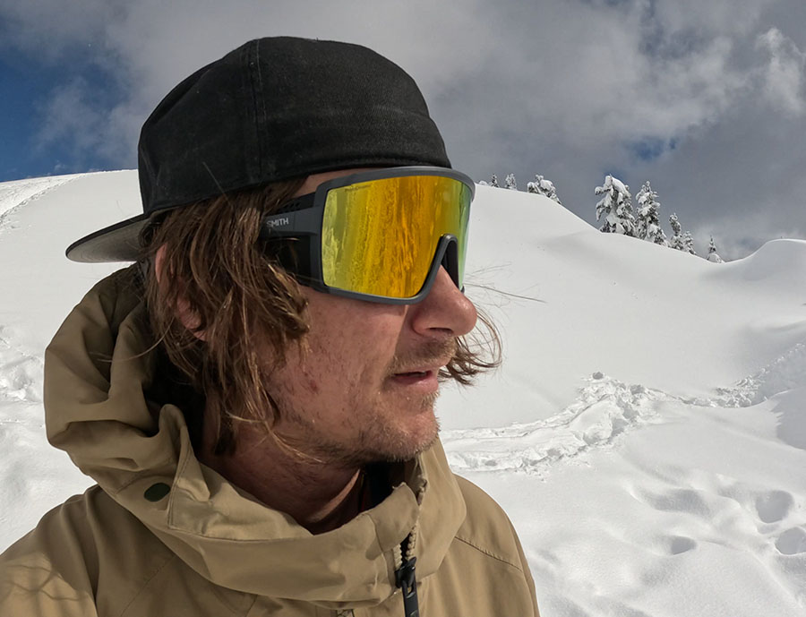 model wearing smith pursuit glacier glasses in the backcountry