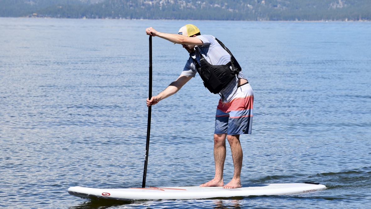 mad paddle boarding in lake tahoe with the astral e-ronny life jacket