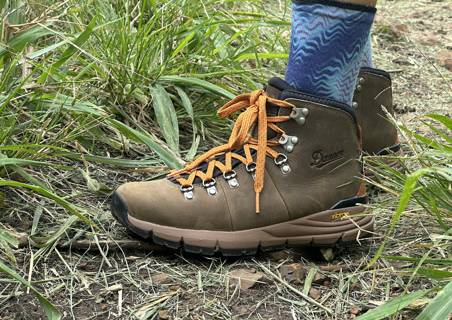 a close up of a woman wearing Danner hiking boots