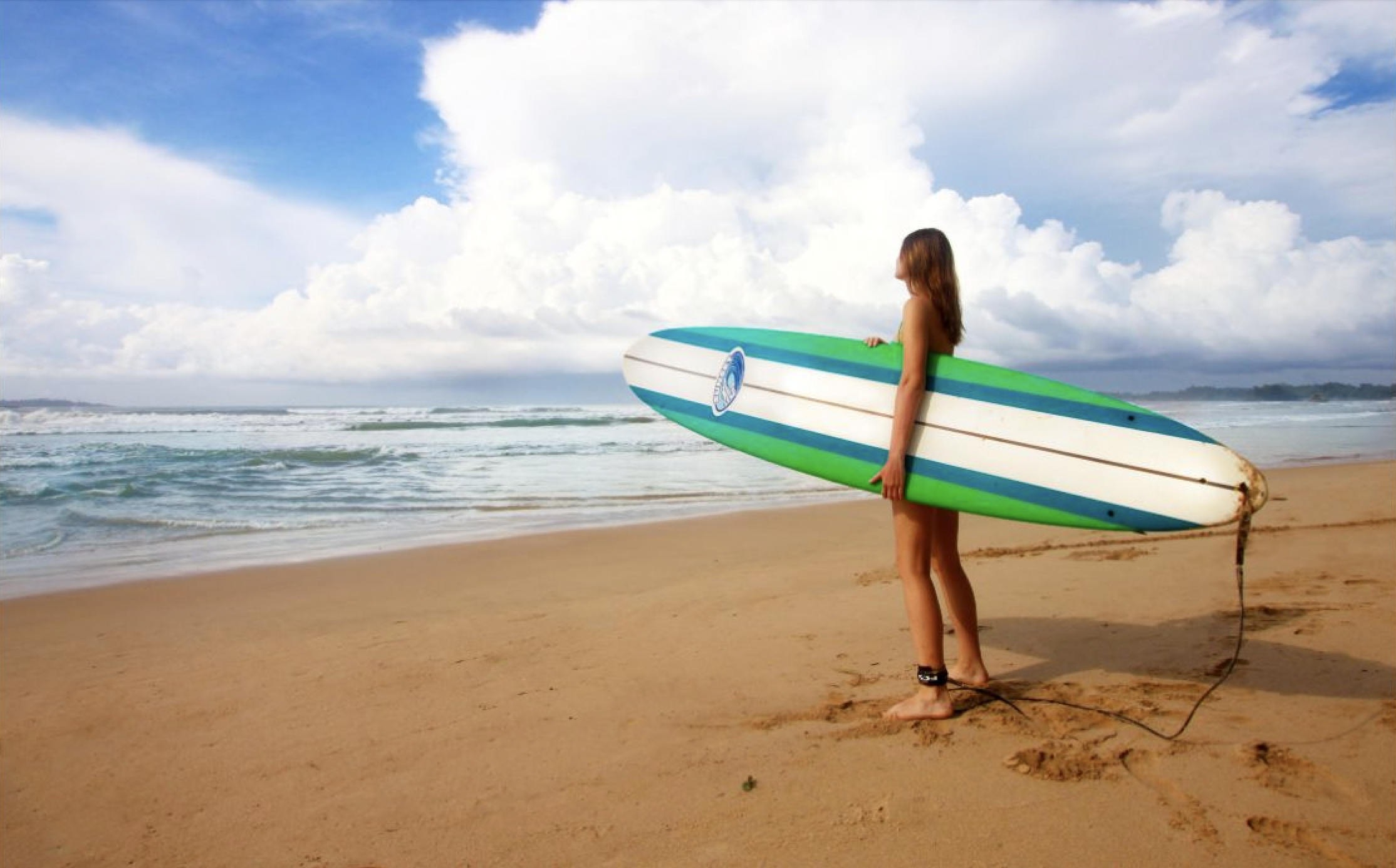 Paddling out on a longboard.
