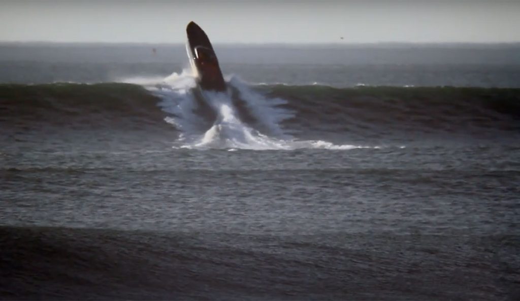 Cigarette Boat on wave at Ocean Beach