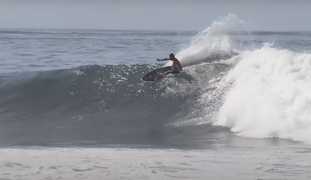 Kai Lenny surfing Keramas