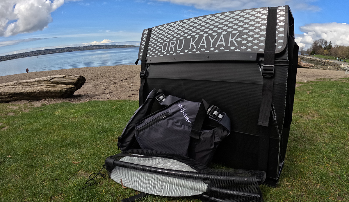 The Beach LT Sport by Oru Kayak, folded up in carry mode on the beach