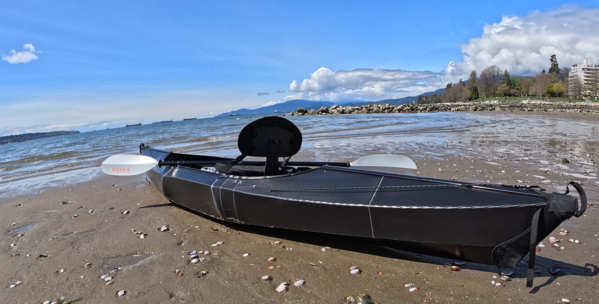 Oru Kayak's beach lt sport foldable kayak on the beach, ready to go exploring.