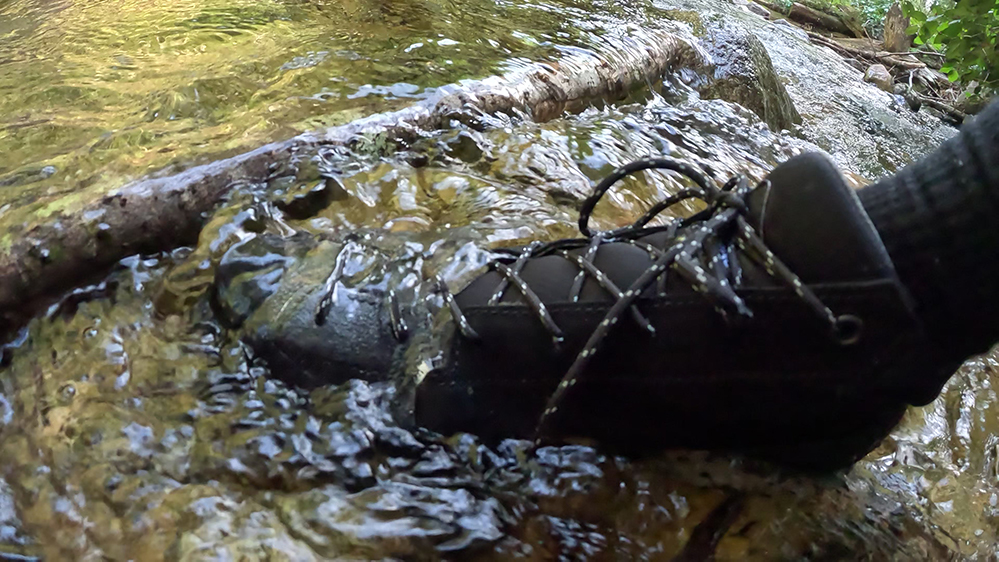 The Zamberlan Salathe RR GTX submerged in a puddle of water