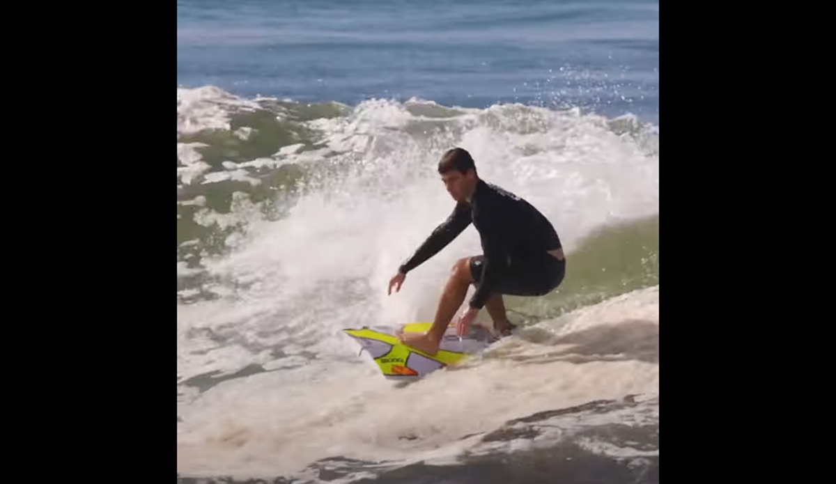 Jack Robinson riding half a board.