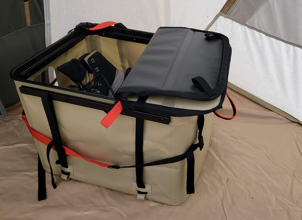 The RUX storage system in a tent, with the lid folded back