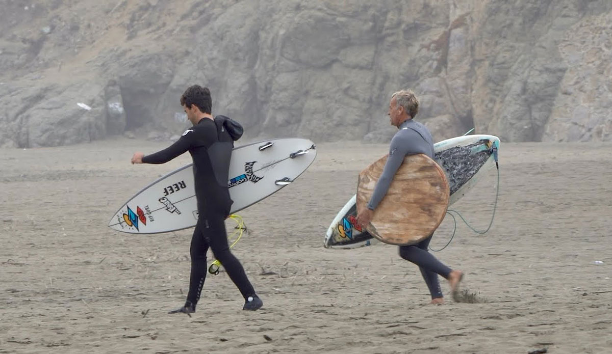 Tom Curren and Mason Ho with surfboards
