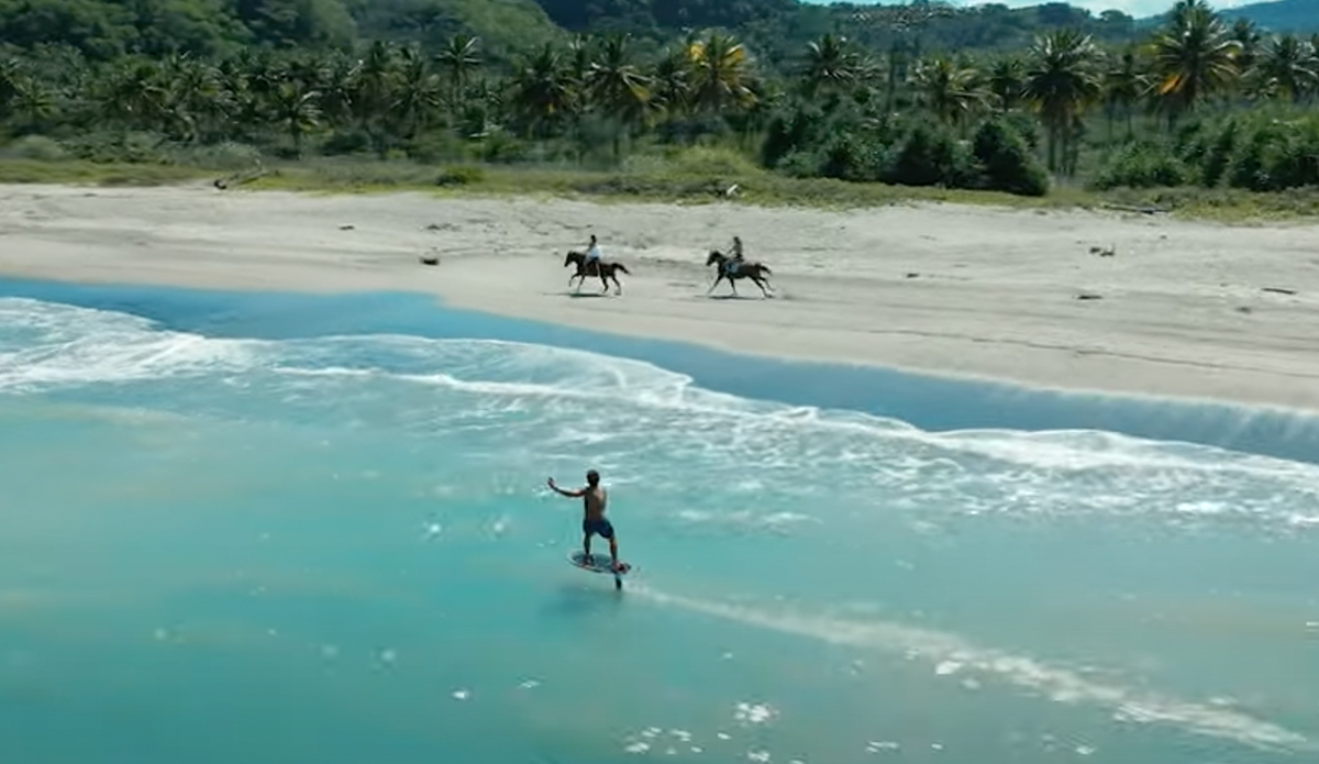 Kai Lenny gets towed by a horse.