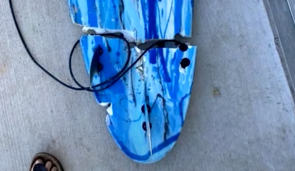 Toby Begg's surfboard, broken in half by the shark that bit him. Source: 9 News Australia // Youtube