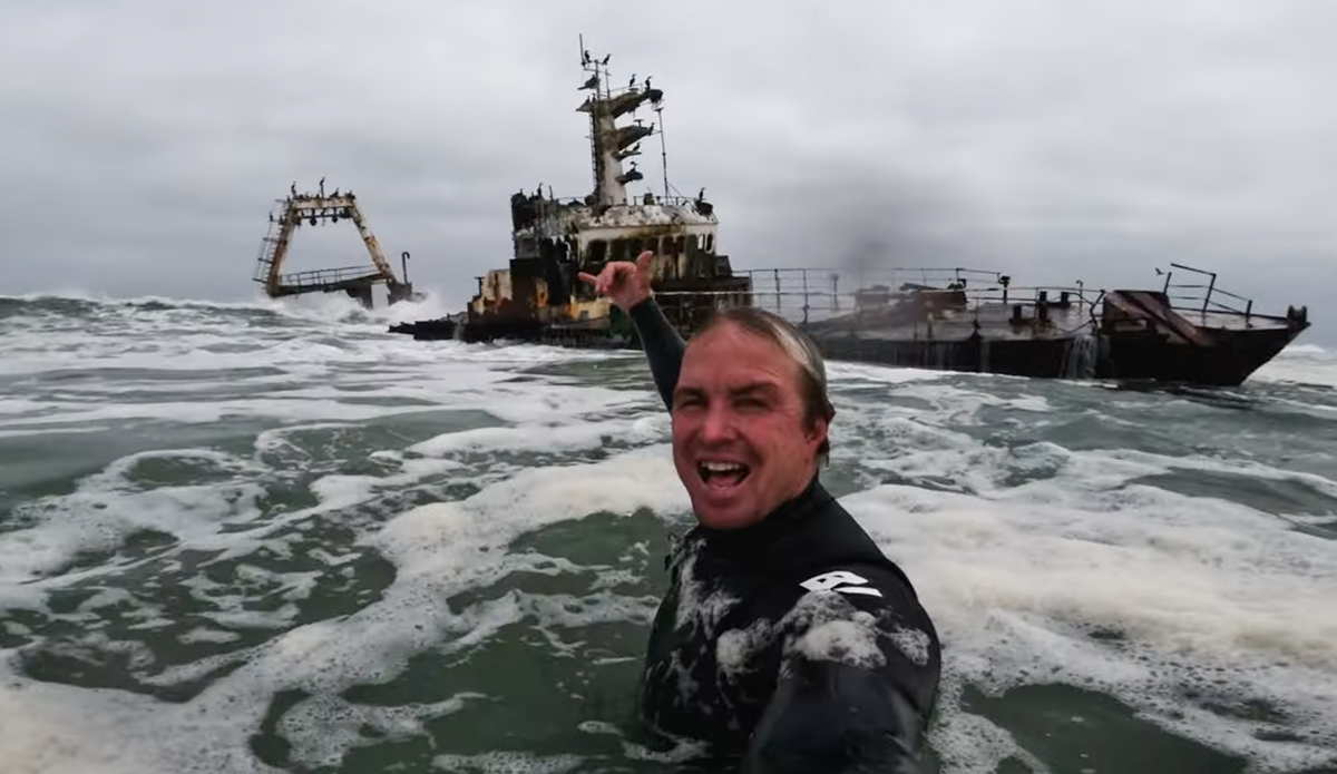 Jamie O'Brien surfs a shipwreck.