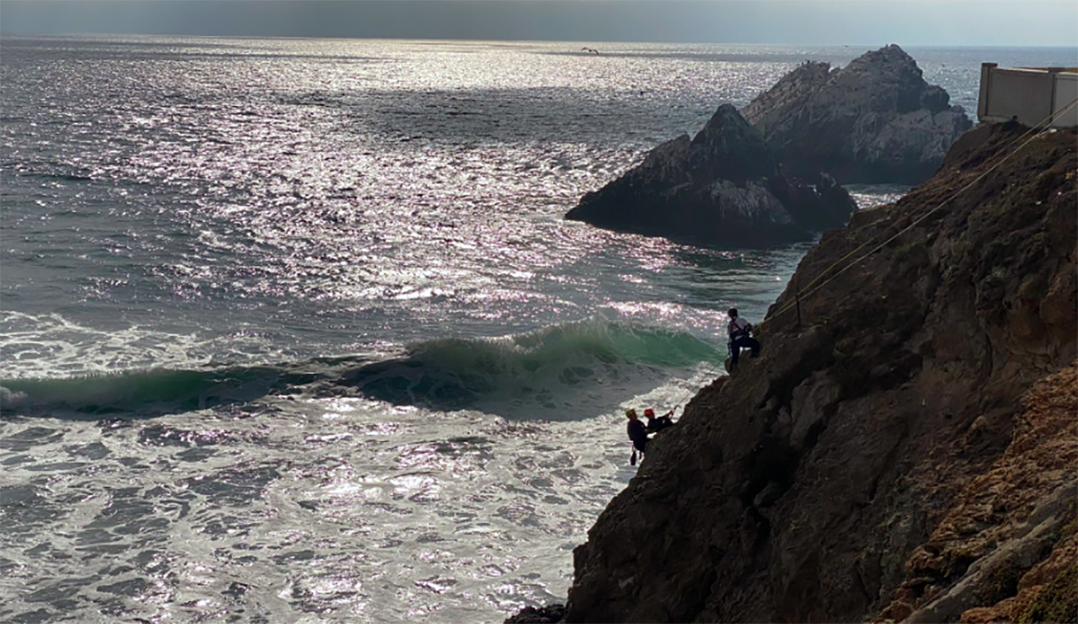 san francisco fire dept rappels down cliff to rescue surfer