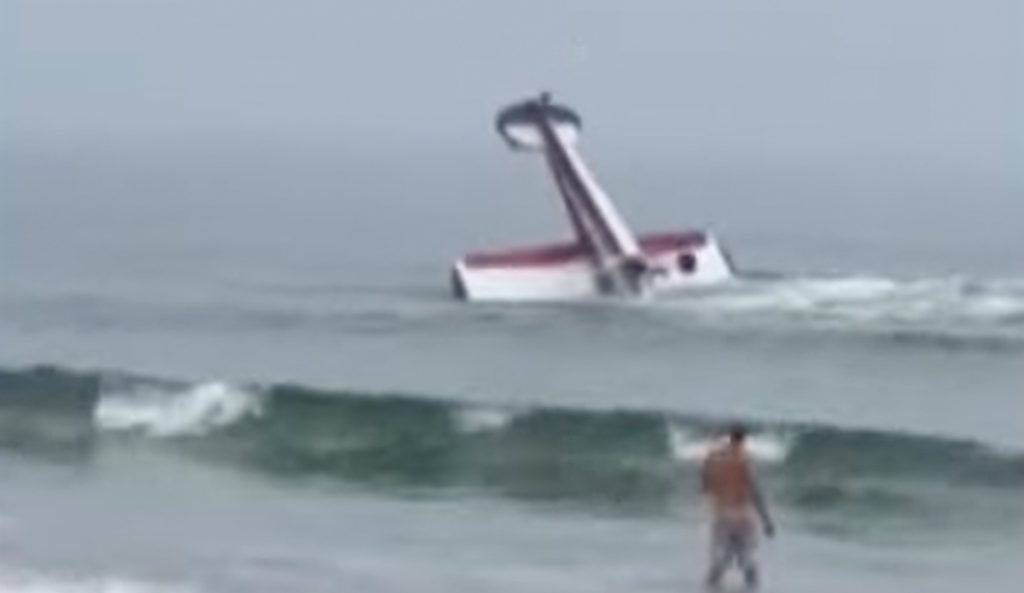 Plane crashes off New Hampshire beach.