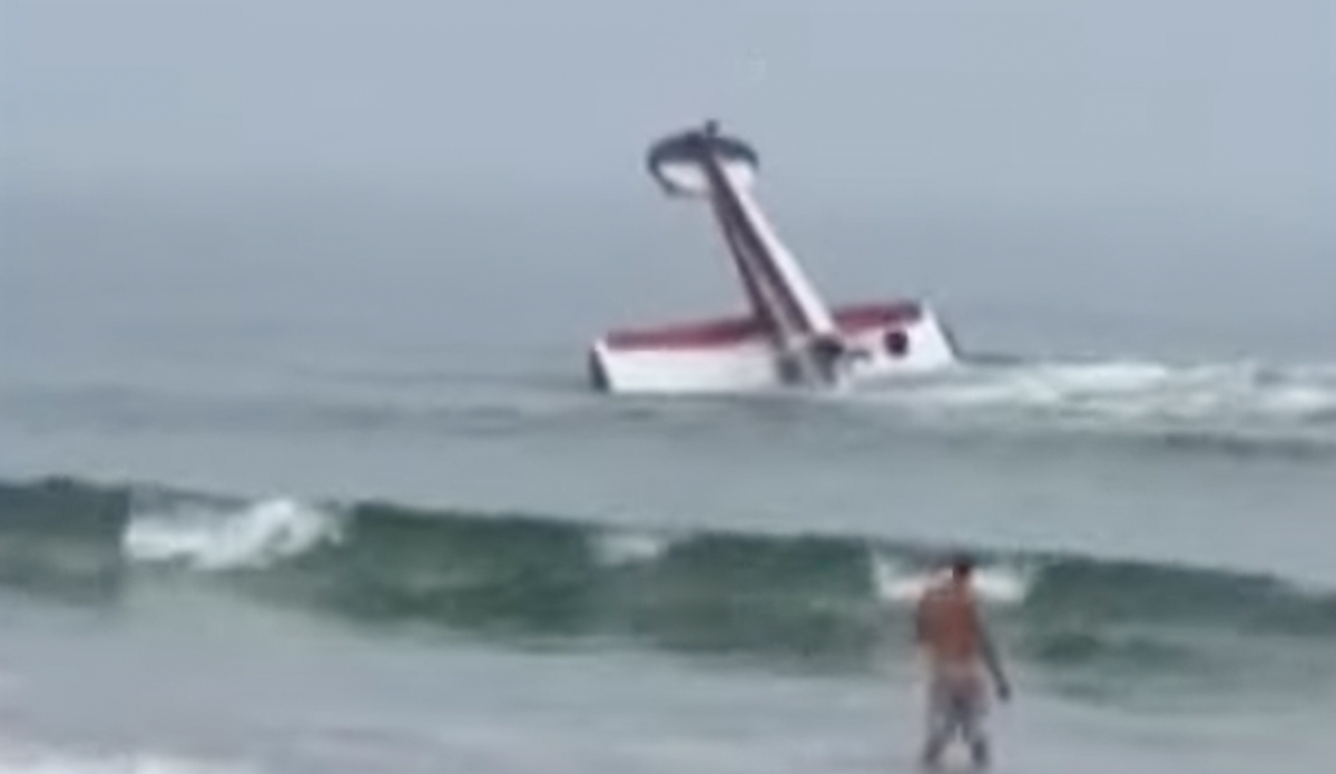 Plane crashes off New Hampshire beach.