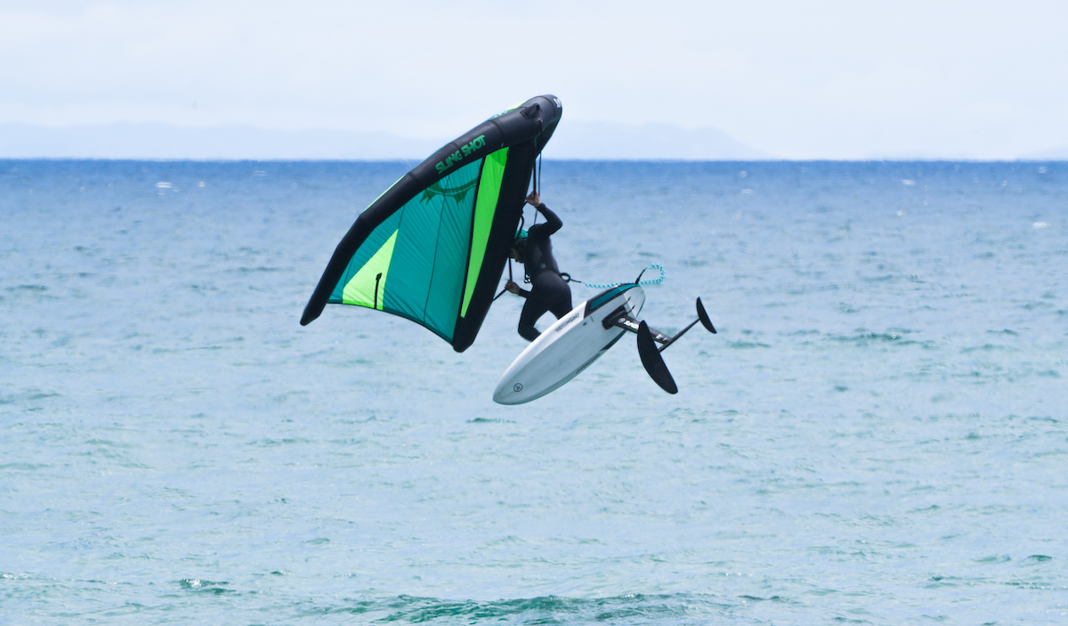 Jesse Faen jumping on a wing foil