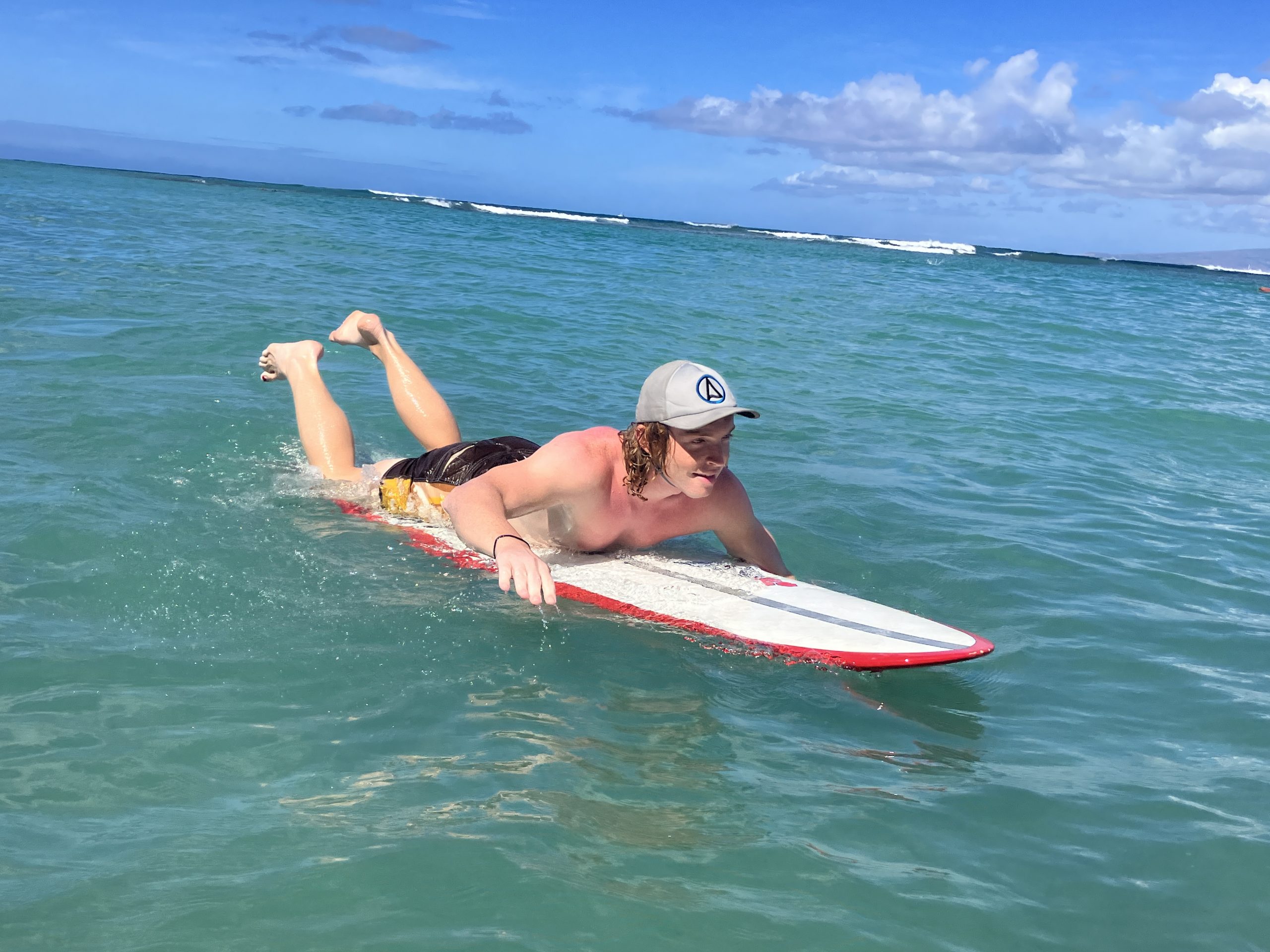 a man wearing one of the surf hats we tested for this guide