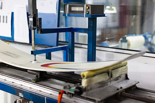 Pressure testing a snowboard at the Arbor factory for our list of the best snowboard brands