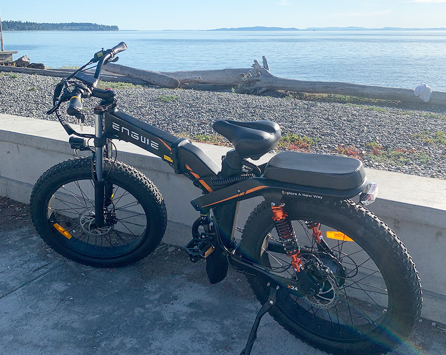 engwe x24 ebike next to a beach