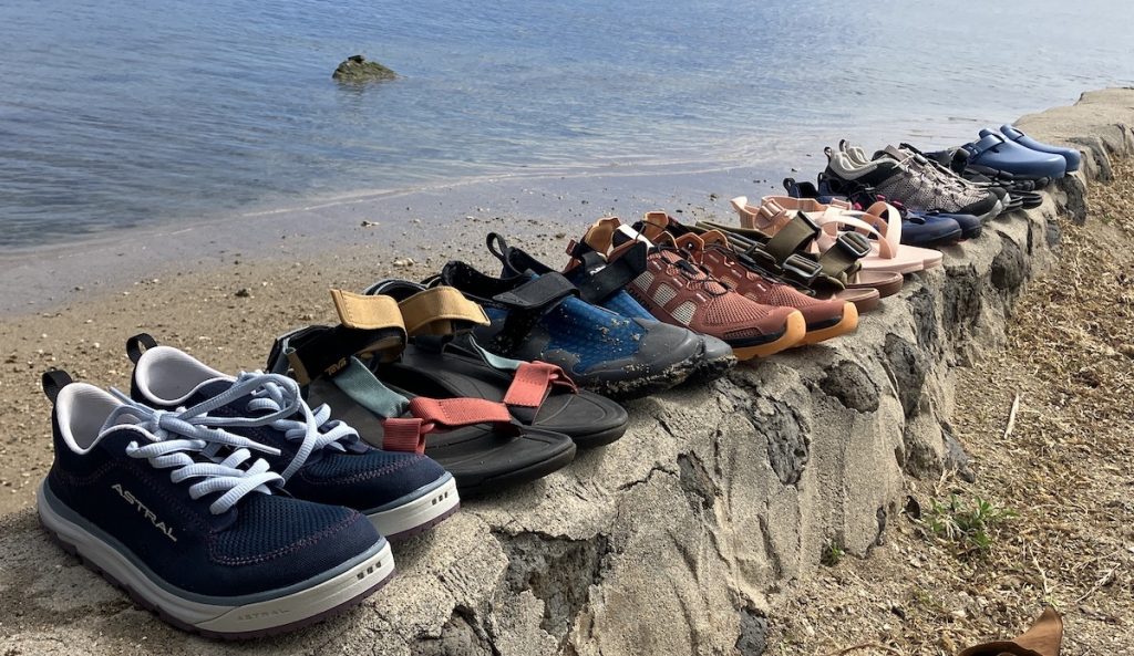 a line of water shoes on a stone wall