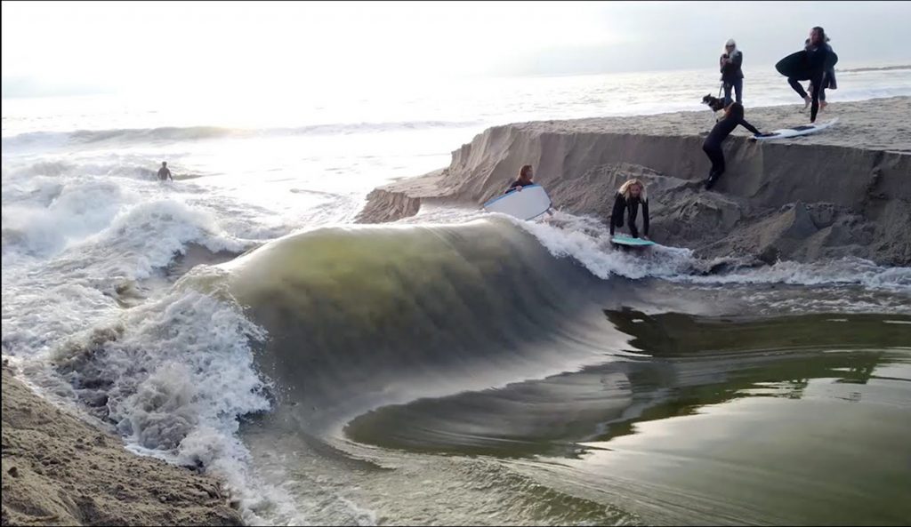 The debate about whether surfers should be able to manually breach the sand berm to surf a standing wave at Aliso Creek has again bubbled to the surface.