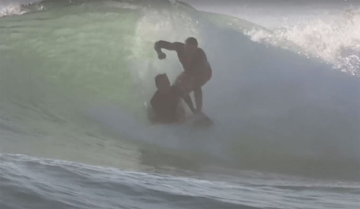 surfer punches boogie boarder
