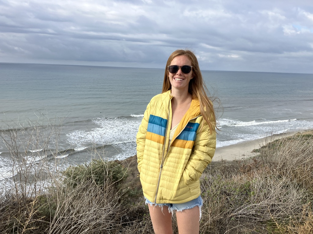 woman on the bluffs wearing a puffer jacket