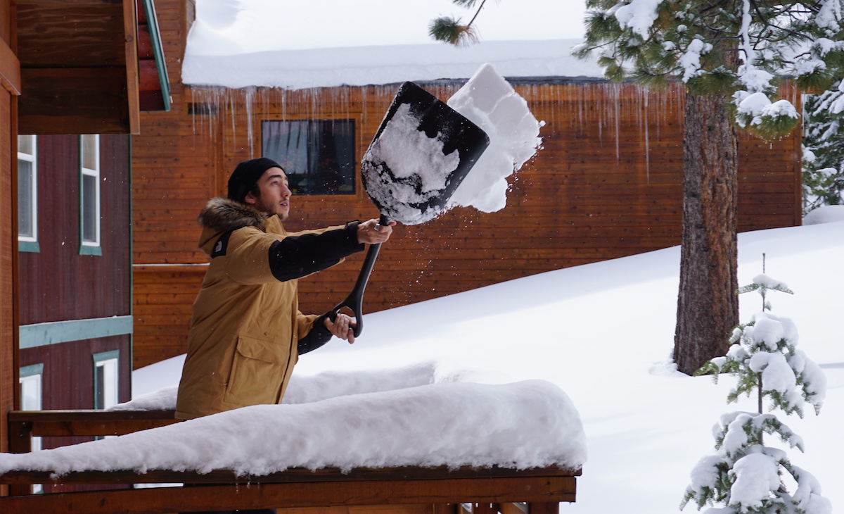 Shoveling snow in the TNF McMurdo Down Parka