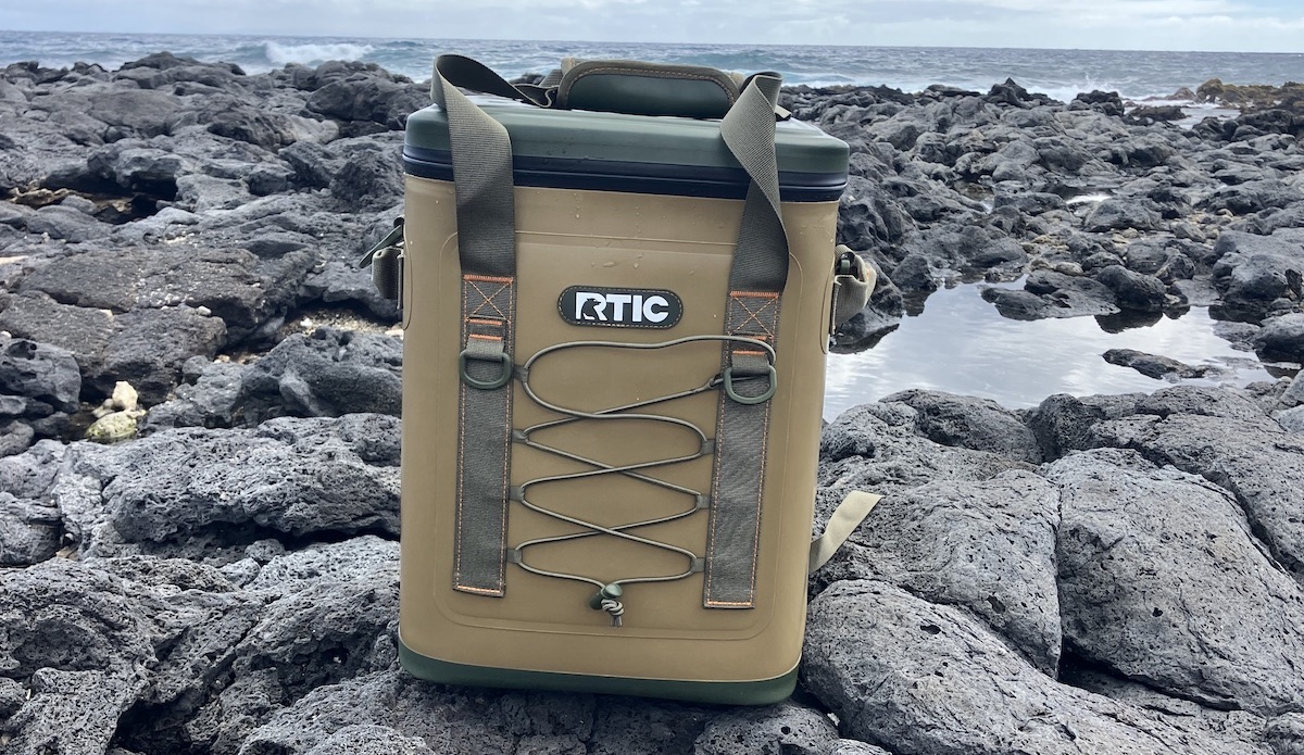 RTIC Backpack Cooler sitting on rocks at the beach