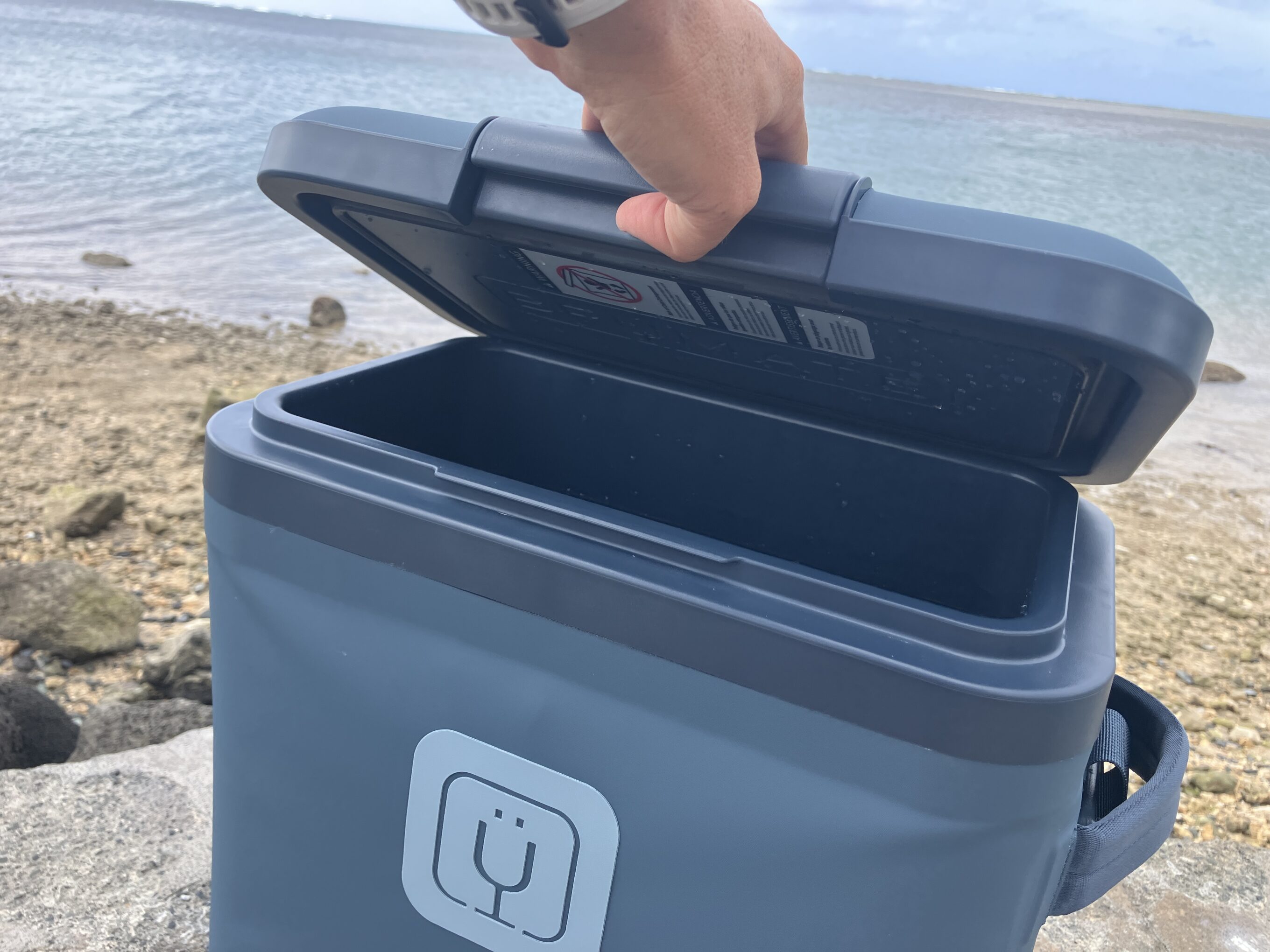 the opening of a blue cooler
