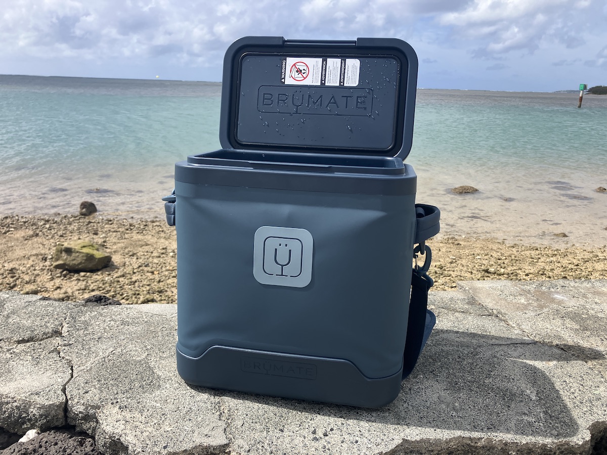 an open blue cooler on the beach