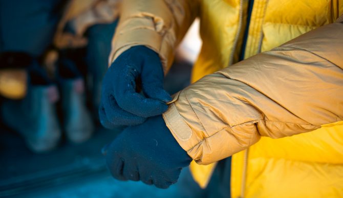 Demonstrating the velcro cuffs on the Rab Neutrino Pro Winter Jacket