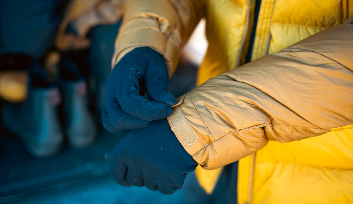 Demonstrating the velcro cuffs on the Rab Neutrino Pro Winter Jacket