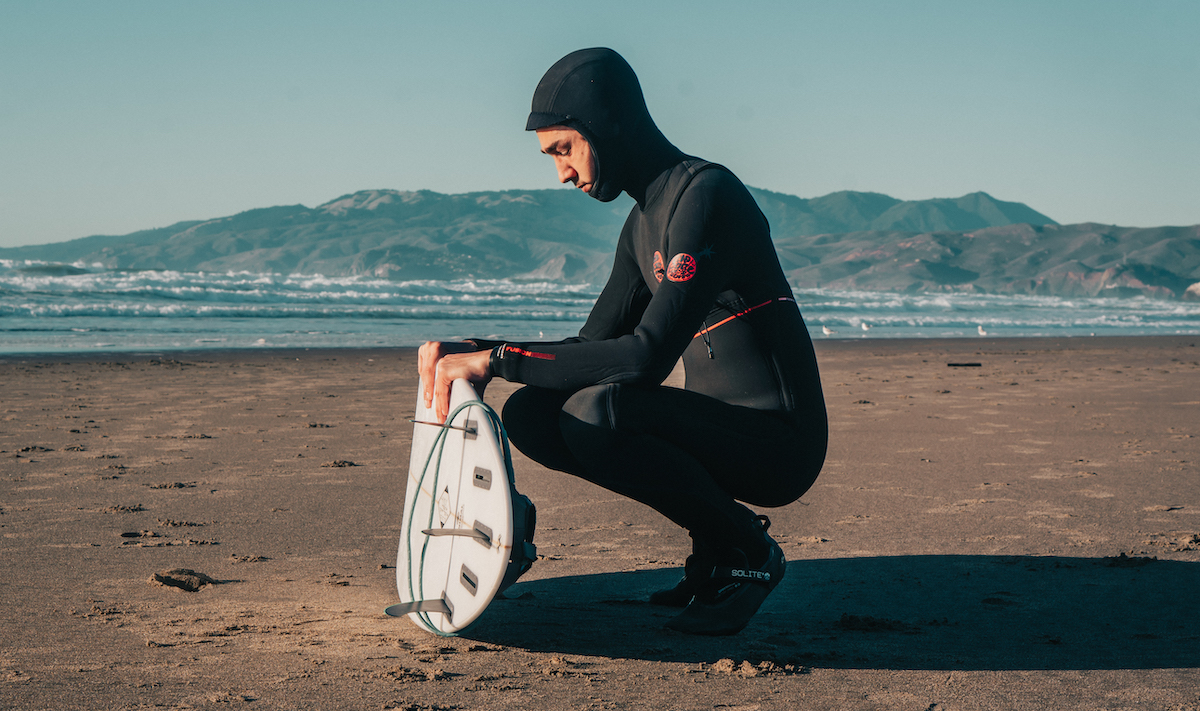 Rip Curl Fusion Wetsuit kneeling at Ocean Beach