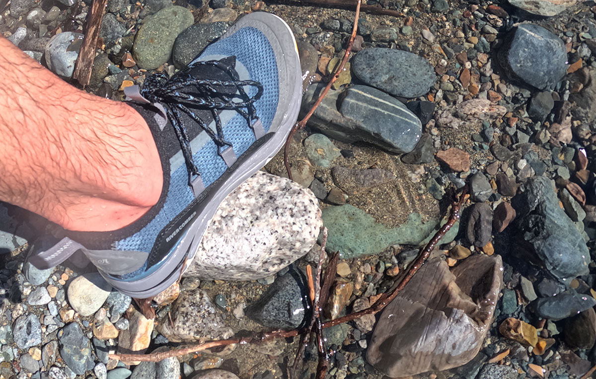 Danner's Rivercomber water shoes walking on a rocky coastline