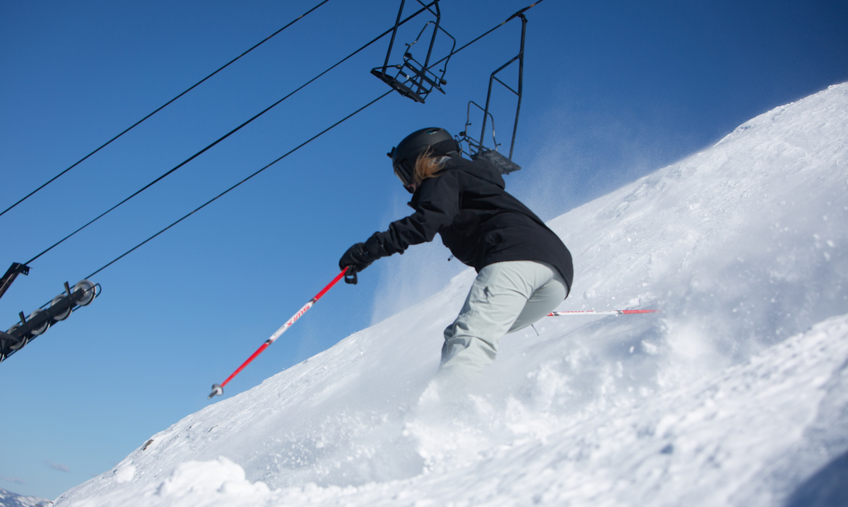 Skiing in the Patagonia Snowdrifter women's ski bib