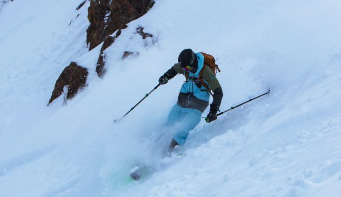 Skiing in the Strafe Outerwear Nomad Ski Jacket and Bibs