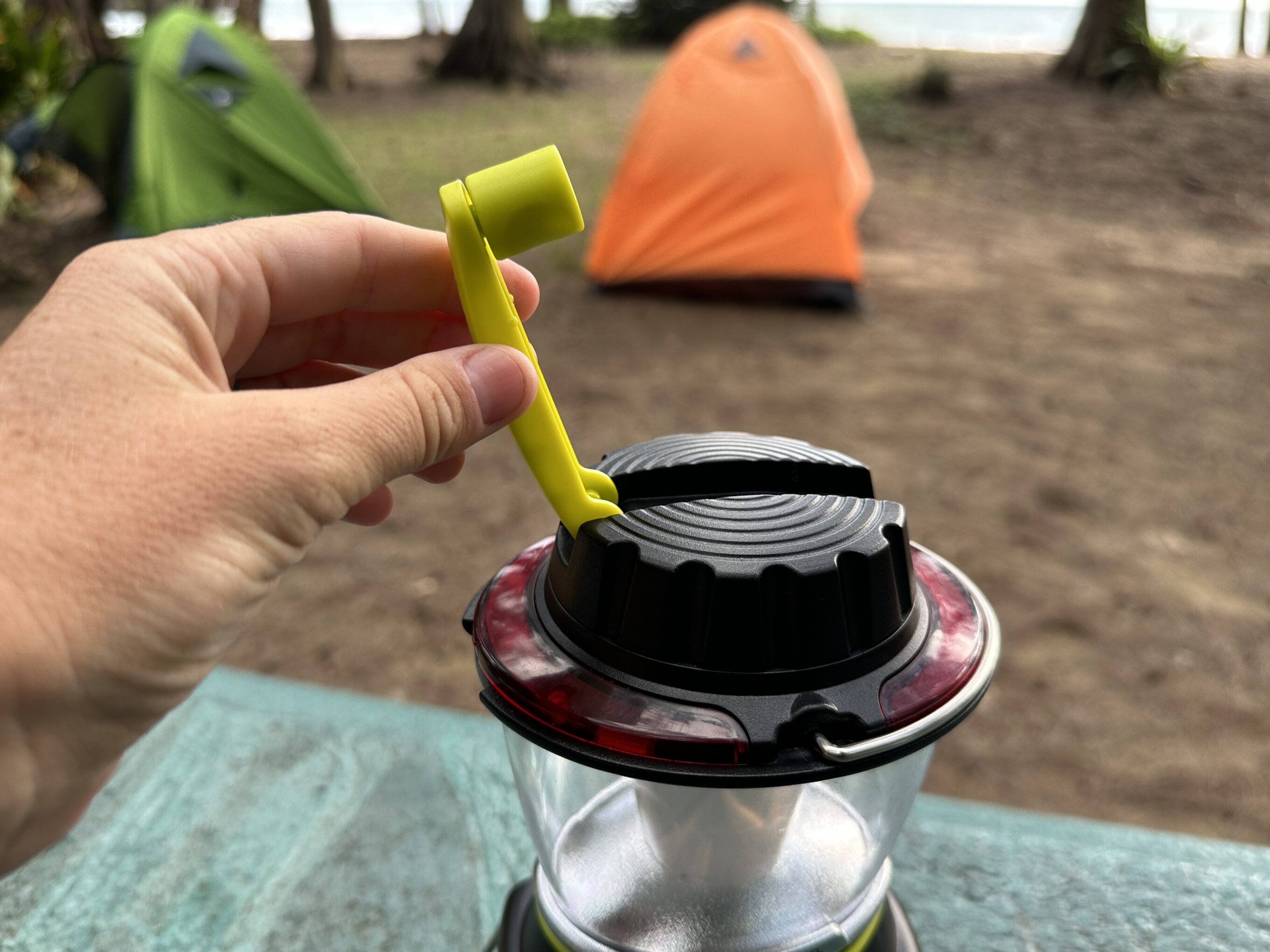a handle on a camping lantern