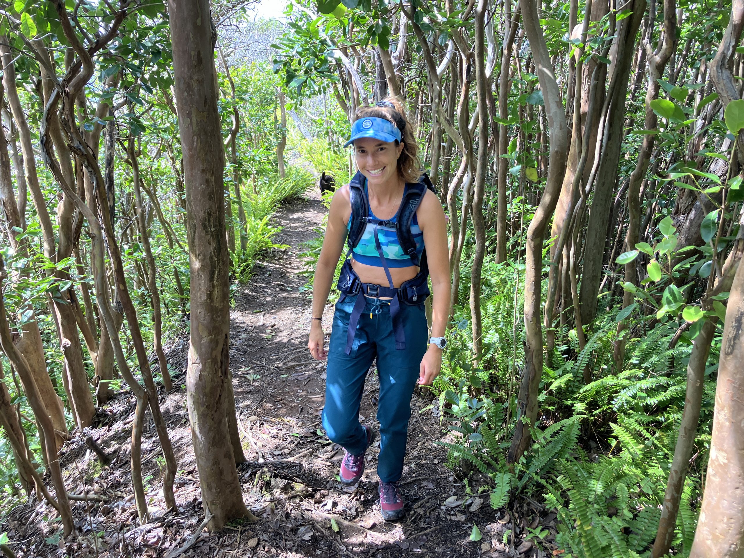 a woman hiking in the forest