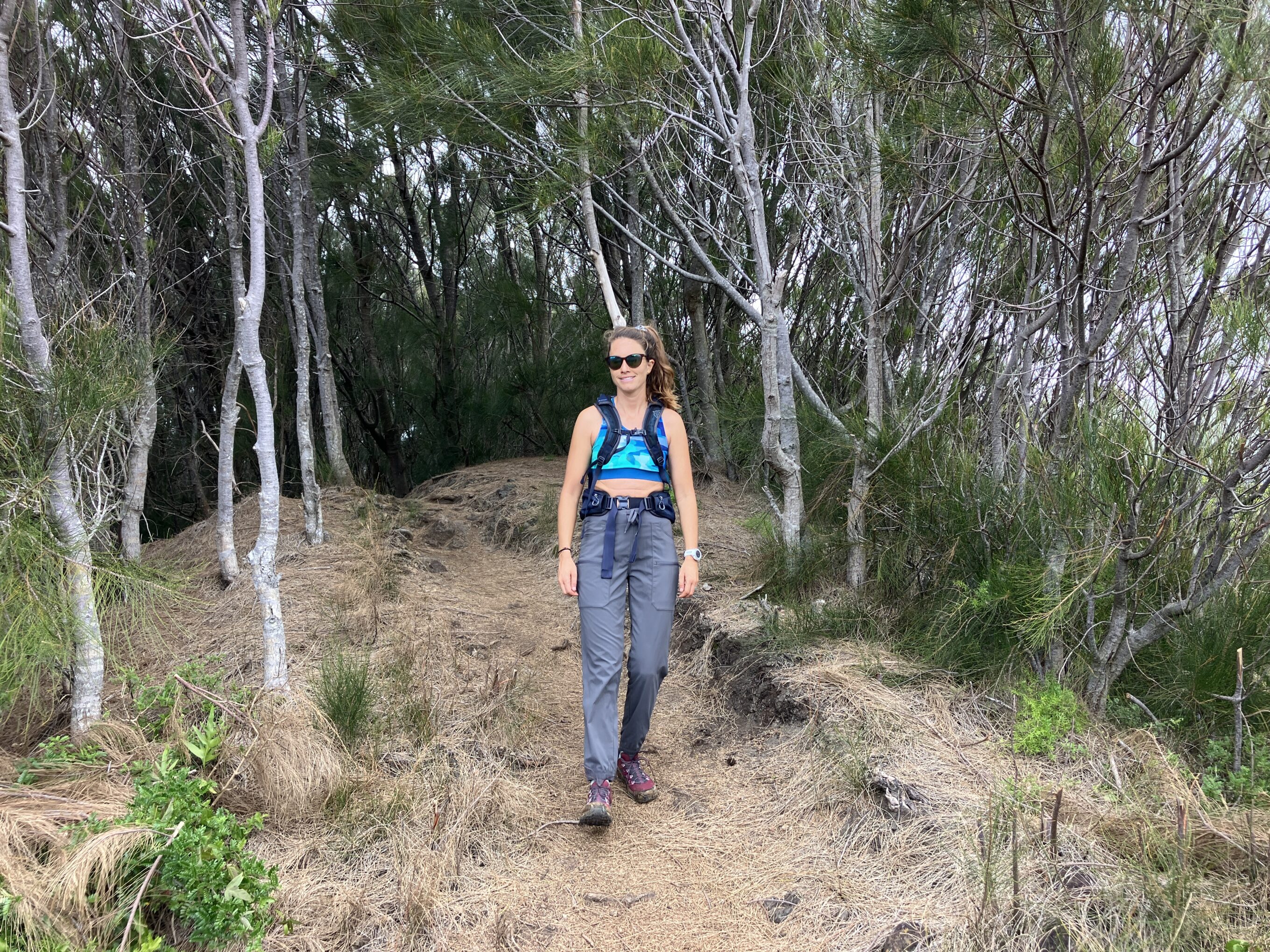 a woman hiking in hiking pants