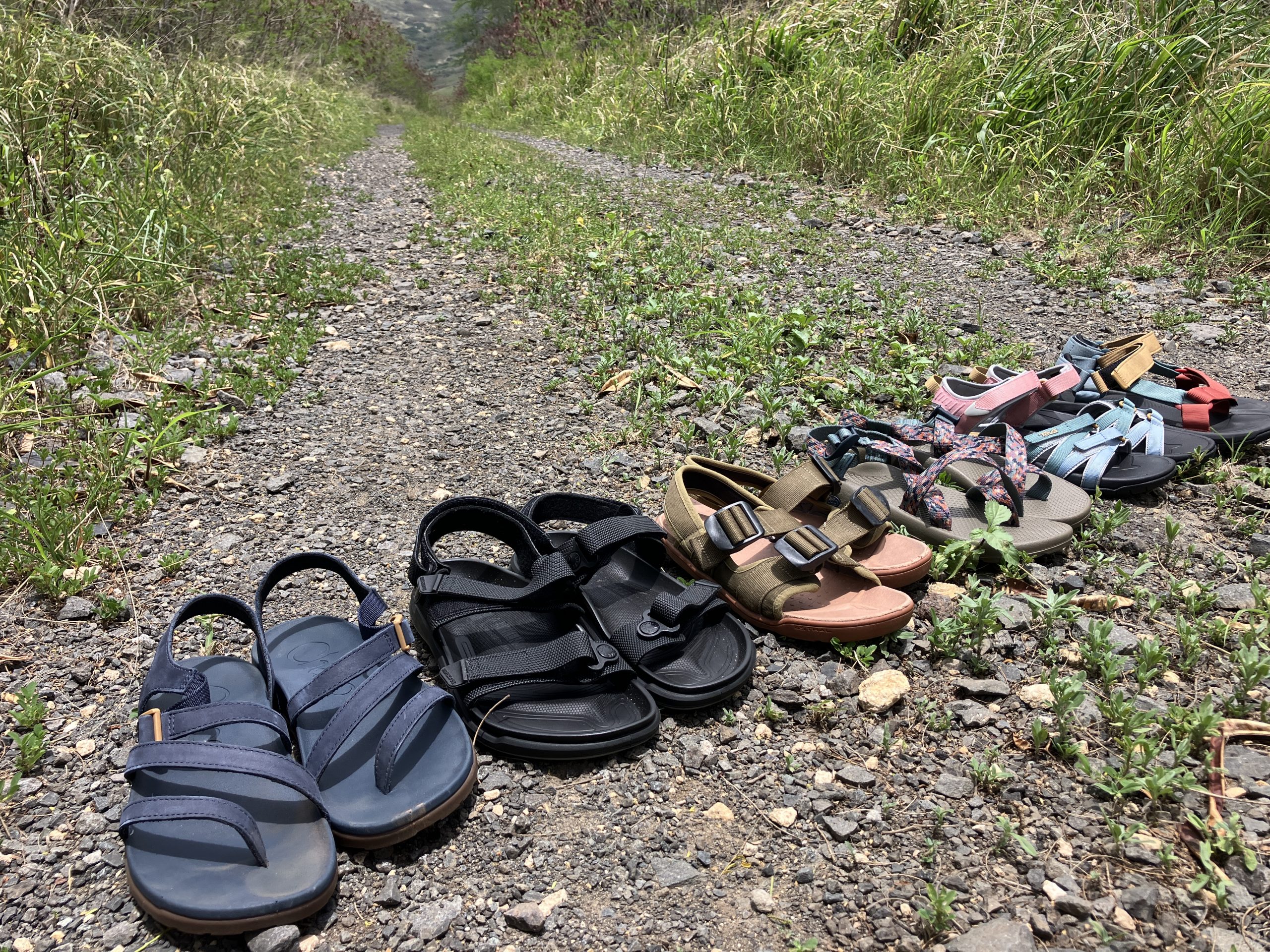 a bunch of hiking sandals lined up