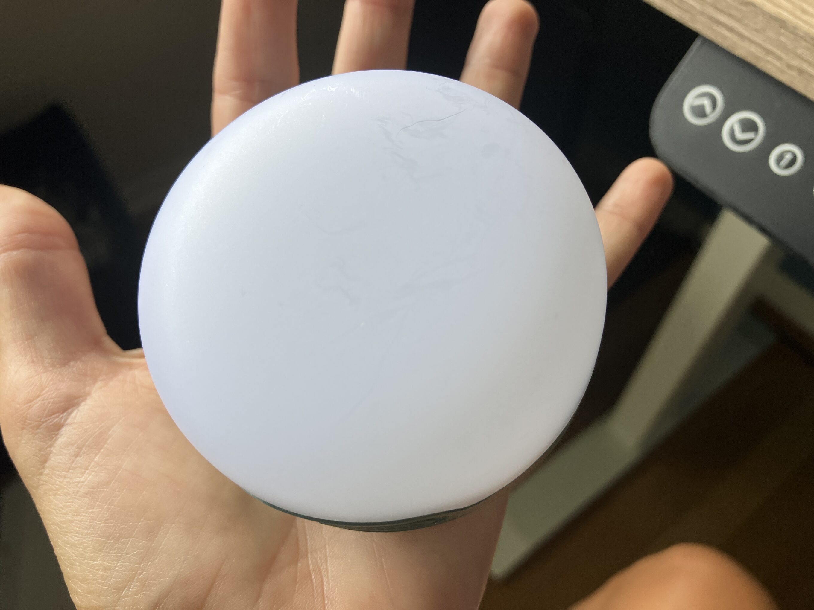 a camping lantern in someone's hand