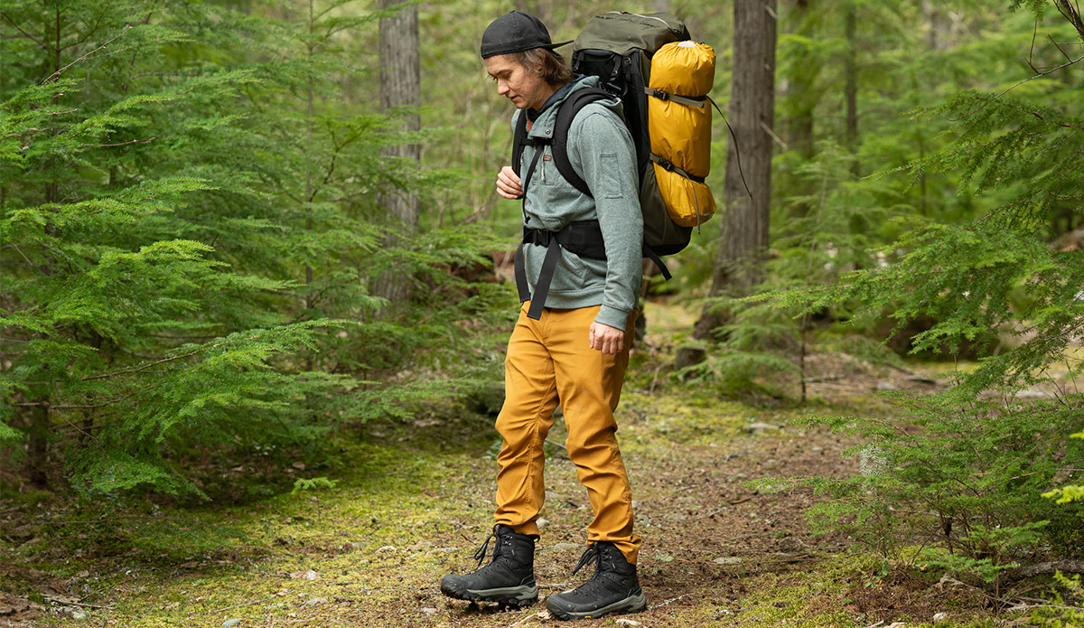 a hiker in the forest with the oboz bangtail mid winter hiking boots